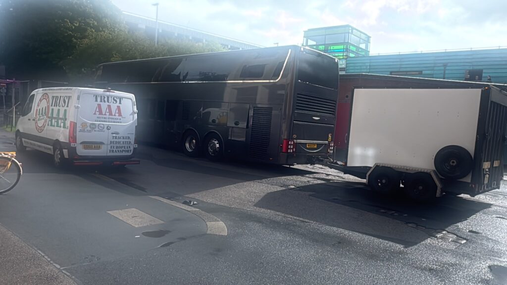 AAA Vans supporting a tour bus and equipment trailer with live music logistics