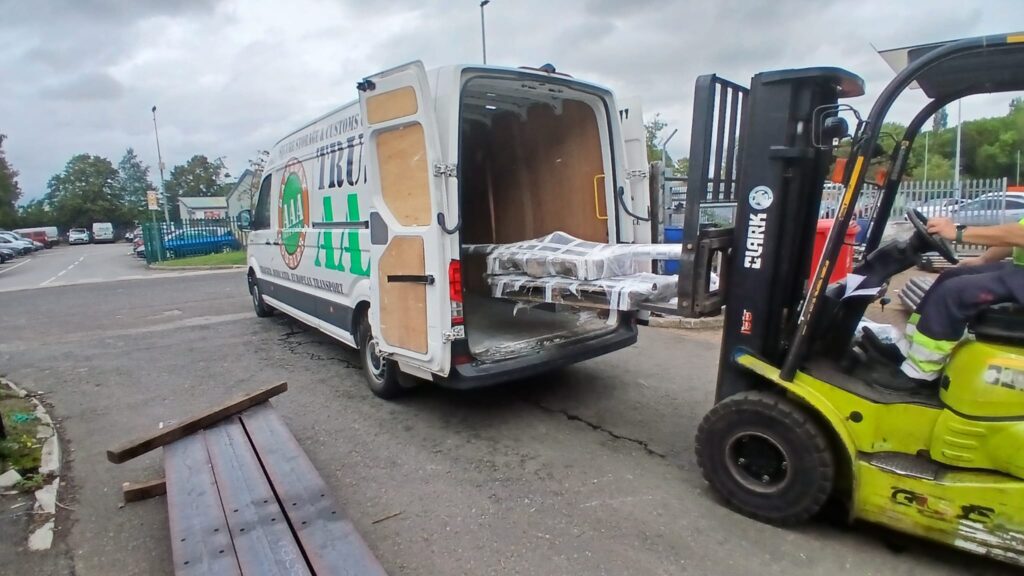 Wrapped steelwork secured in an AAA Vans courier van ready for sign manufacturing delivery